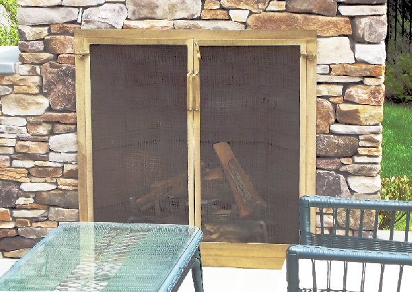 solid bronze attached mesh door screen outside fireplace on stone