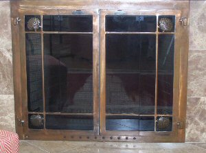 The Welfleet window - pain full fold doors shown in oil rubbed bronze