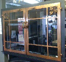 natures window in black and antique copper finishes with full fold doors